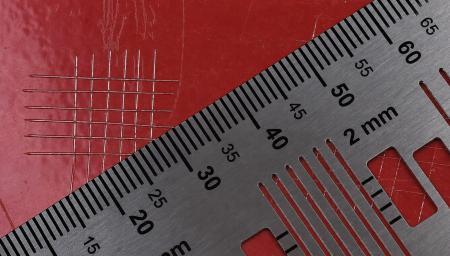 Example of a grid pattern on a red aluminium component